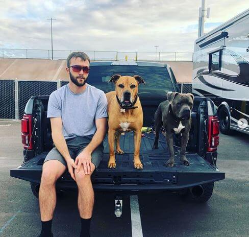 Lev Loe Tomac's father with their dogs, Gnarly and Bear